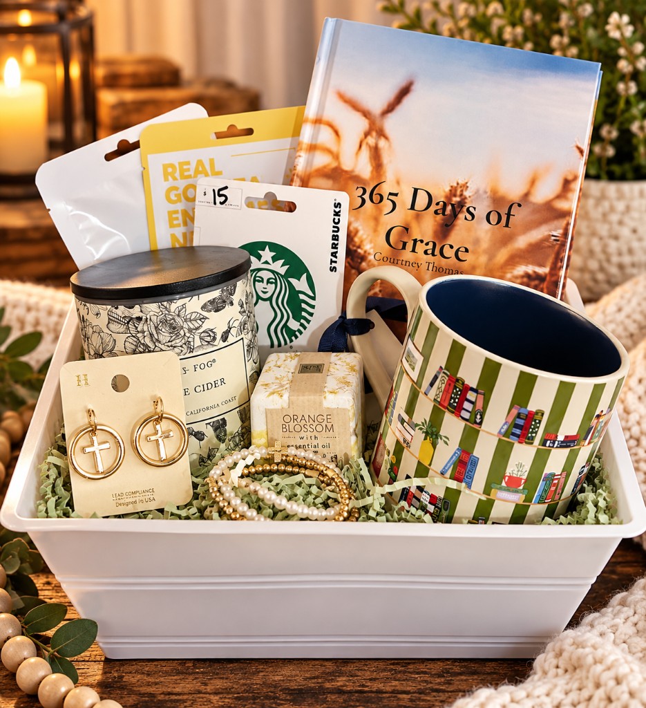 White gift tray holding an autographed copy of 365 Days of Grace, a striped mug, a candle, and cross earrings